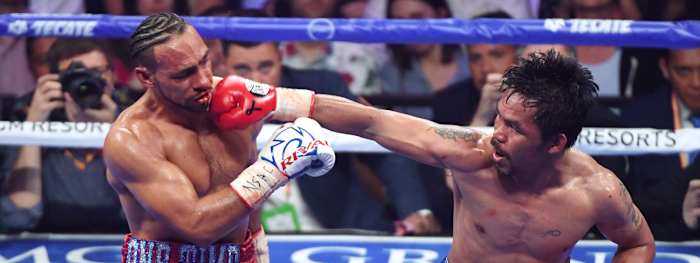 LAS VEGAS, NEVADA - JULY 20:  Manny Pacquiao (R) throws a right at Keith Thurman in the sixth round of their WBA welterweight title fight at MGM Grand Garden Arena on July 20, 2019 in Las Vegas, Nevada. Pacquiao won in a split decision.  (Photo by Ethan Miller/Getty Images)